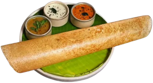 Dosa on a banana leaf with chutneys